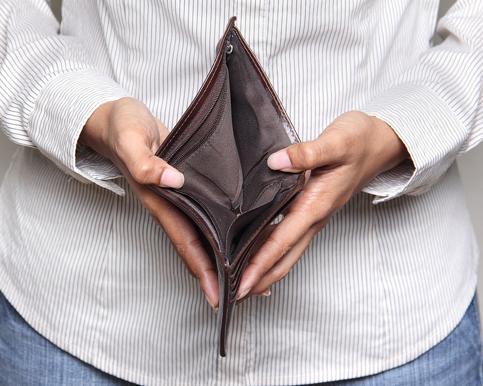 Person holding an empty wallet - showing bankcruptcy